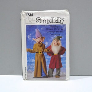 May include: Simplicity sewing pattern for Walt Disney's Dopey Dwarf and Grumpy Dwarf costumes. The pattern envelope features illustrations of the two dwarf costumes. The envelope is white with the number 1736 and size 6-8 printed on it.