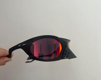 Oakley Plantaris sunglasses Black frames red lenses