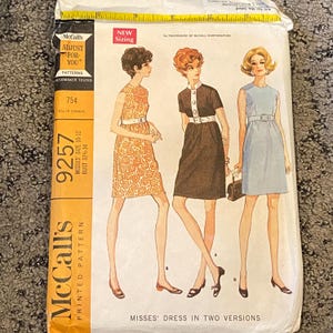May include: Vintage McCall's printed pattern for Misses' dresses, size 10-12, bust 32½-34 inches. The pattern envelope features illustrations of three dresses in different colors and styles. The envelope is yellow and white with the McCall's logo.