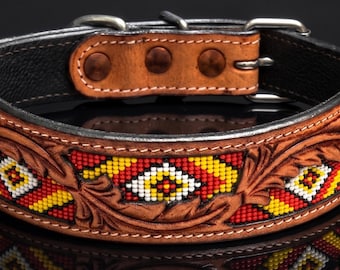 May include: Brown leather dog collar with intricate carved floral designs and colorful beaded accents in red, yellow, and white. Features a black interior and silver-tone hardware. A stylish accessory for pets.