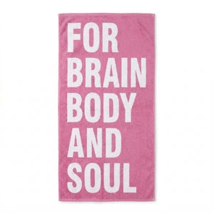 May include: A pink rectangular towel with the words "FOR BRAIN BODY AND SOUL" printed in large white capital letters. The towel is made of a soft, absorbent material, perfect for use at the beach, gym, or home.