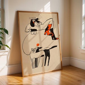 May include: A framed wall art print on a beige background featuring a black line drawing of a person in a cowboy hat and boots, holding a lasso. Below, a horse and a dog are depicted in black and white with a small orange circle above them.