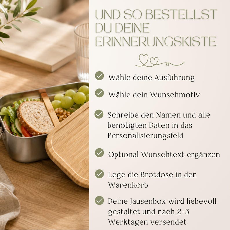 Peut inclure: Une bo&icirc;te &agrave; lunch en acier inoxydable avec un couvercle en bois, contenant un sandwich, des raisins et des noix. L'image montre &eacute;galement un verre d'eau et du texte en allemand.