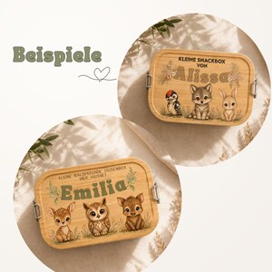 Peut inclure: Bo&icirc;tes &agrave; lunch en bois avec des illustrations d'animaux de la for&ecirc;t et des noms. L'une pr&eacute;sente un pic, un loup et un lapin avec le nom "Alissa". L'autre bo&icirc;te a un cerf, un hibou et un faon avec le nom "Emilia". Le mot "Beispiele" est &eacute;galement visible.