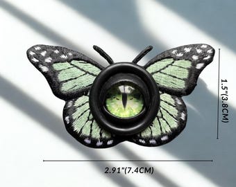 Broche de cabelo com olho de borboleta gótica, alfinete de borboleta com olho de demônio, acessório de cabelo com inseto gótico, joia de terror Weirdcore, moda alternativa.