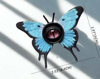 Broche de cabelo com olho de borboleta gótica, alfinete de borboleta com olho de demônio, acessório de cabelo com inseto gótico, joia de terror Weirdcore, moda alternativa.