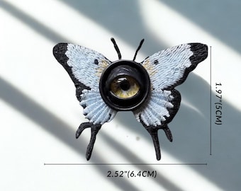 Broche de cabelo com olho de borboleta gótica, alfinete de borboleta com olho de demônio, acessório de cabelo com inseto gótico, joia de terror Weirdcore, moda alternativa.