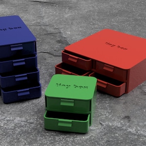 May include: A distressed wooden sign, inscribed with 'Welcome to our home' in white lettering. The sign has a rustic finish, ideal for a porch or hallway, creating a welcoming atmosphere.