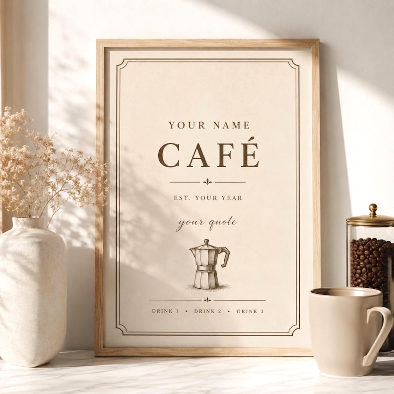 Minimalist personalized coffee wall art poster displayed in a warm neutral kitchen coffee corner. Beige vintage café print with customizable café name, quote, year and moka pot illustration in a wooden frame. Cozy Japandi coffee station decor with soft natural lighting and warm brown tones.