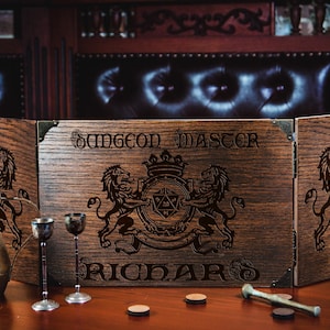 May include: A wooden Dungeon Master screen with engraved lions, a crest, and the text "Dungeon Master" and "Ricard". A brass pitcher and two goblets are on the table.