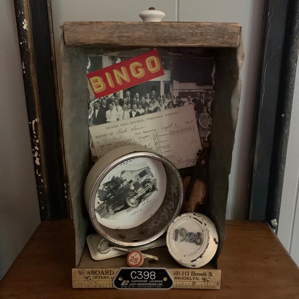 Rustic shadowbox assemblage with a 1928  school theme full of vintage items