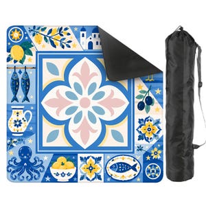 May include: A decorative yoga mat with a Mediterranean tile design in blue, white, yellow, and pink. The mat features lemons, fish, and an octopus. A black carrying bag is included.