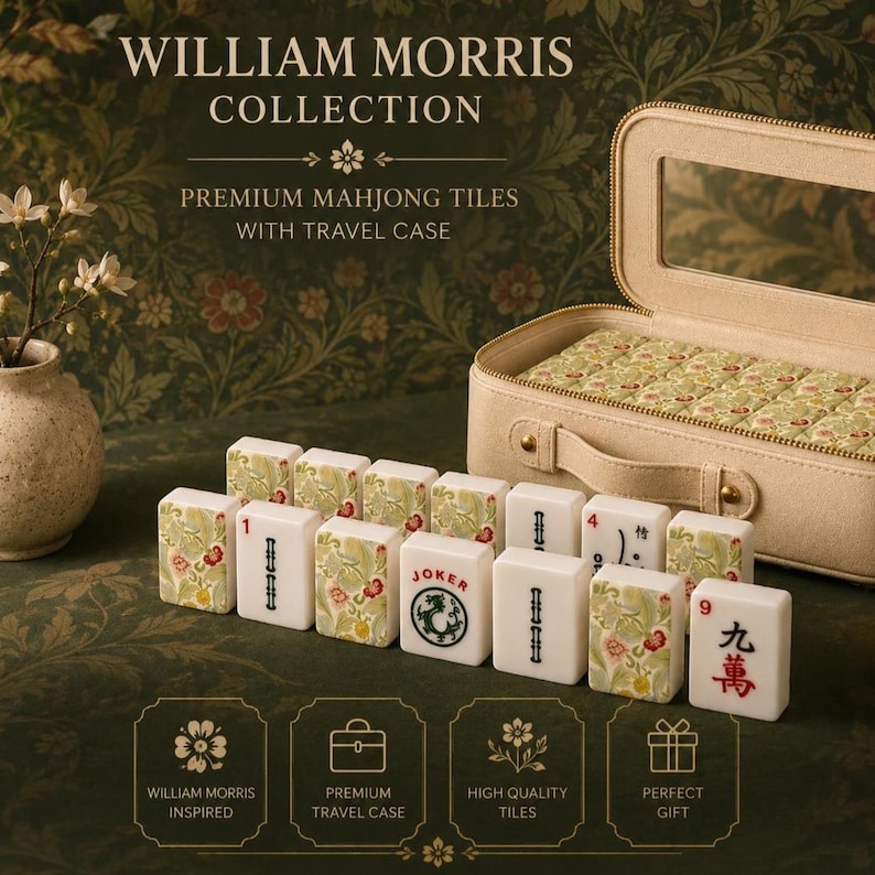 May include: A set of Mahjong tiles featuring William Morris floral patterns and traditional characters, displayed alongside a beige travel case with a top handle. The tiles include a Joker tile and various numbered pieces with red and black ink.