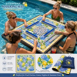 May include: A waterproof Mahjong mat with a floral and lemon design is set up in a pool, with four people playing. The mat is surrounded by a black frame and has blue, yellow, and white accents. The image also shows a rolled-up mat, a carrying bag, and a close-up of the mat's design.