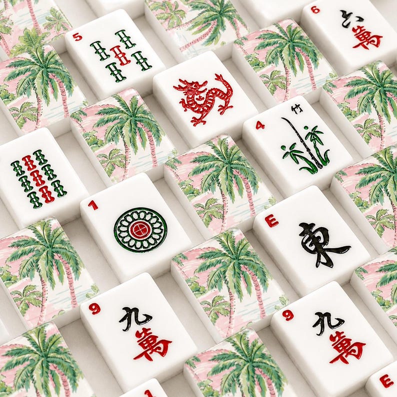 May include: A collection of white Mahjong tiles with various symbols and numbers in red and green. Some tiles feature a palm tree design on a pink background. The tiles are arranged in a grid pattern.