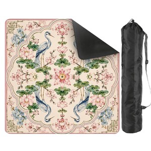 May include: A yoga mat with a floral design featuring pink and blue flowers, green leaves, and blue herons. The mat has a pink border and a black underside. A black carrying bag is included.
