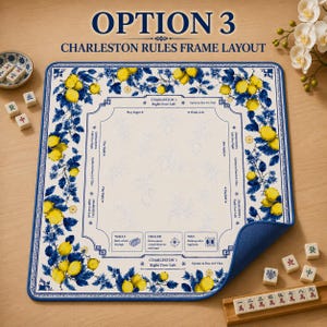 May include: A rectangular Mahjong game mat with a blue border and a white interior. The mat features a blue and yellow lemon and floral design. Text on the mat reads "OPTION 3 CHARLESTON RULES FRAME LAYOUT". Mahjong tiles are visible.