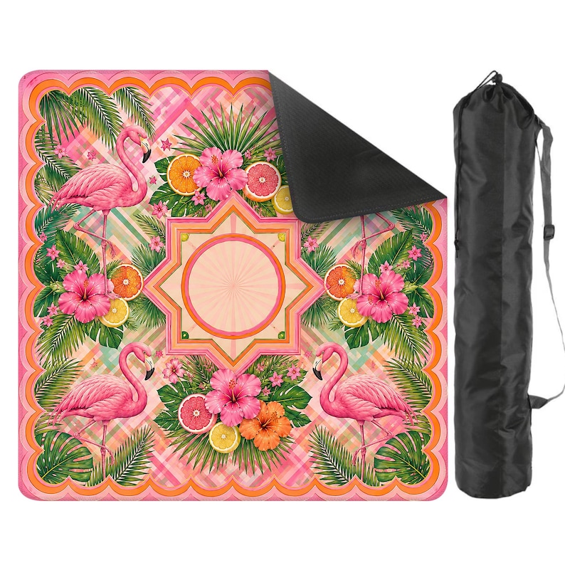 May include: A pink yoga mat with a tropical design featuring flamingos, hibiscus flowers, and citrus fruits. The mat has a black underside and comes with a black carrying bag. The design includes a central star-shaped pattern.