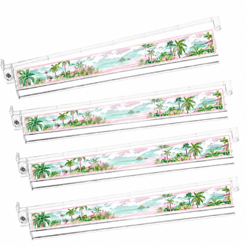 May include: Four clear, rectangular organizers with a tropical landscape design. The design features palm trees, a pink sky, and a turquoise ocean. The organizers have a white border and are made of clear plastic.