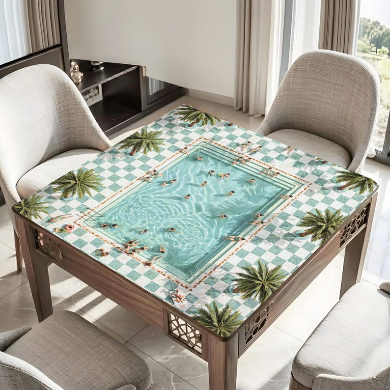 May include: Square wooden table with a unique pool design on the tabletop. The table features a light blue and white checkered pattern with a central pool scene, palm tree accents, and decorative cutouts on the legs.
