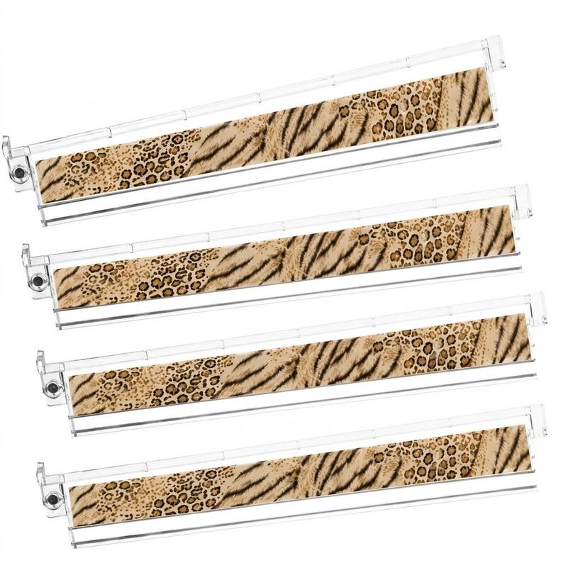 May include: Four clear plastic hanging file folder frames featuring a decorative insert with a tan and brown animal print pattern, combining leopard spots and tiger stripes. Each frame includes a top rail and side hooks for suspension.