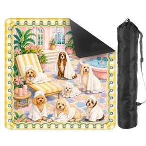 May include: A square outdoor mat featuring a colorful illustration of six golden-colored dogs wearing white towels by a pool, framed by a yellow and white checkered border. The mat has a black underside and includes a black drawstring carrying bag.