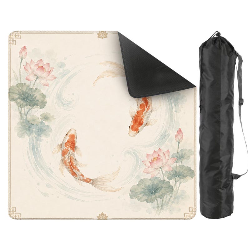 May include: A beige yoga mat featuring a watercolor design of koi fish, lotus flowers, and lily pads. The mat has a black underside and comes with a black carrying bag with a shoulder strap. The mat's design includes shades of orange, pink, and blue.