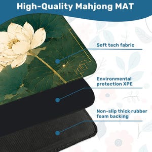 May include: A Mahjong mat featuring a white lotus flower on a dark green background with gold line art. The mat consists of three layers: a soft tech fabric top, an environmental protection XPE middle layer, and a non-slip thick rubber foam backing.