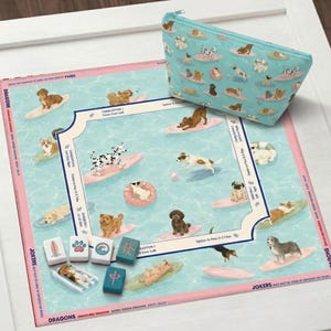 May include: A dog-themed game set featuring a board with dogs surfing on waves, a matching zippered pouch, and game tiles. The board has a light blue background with pink borders and the text "DRAGONS" and "JOKERS".