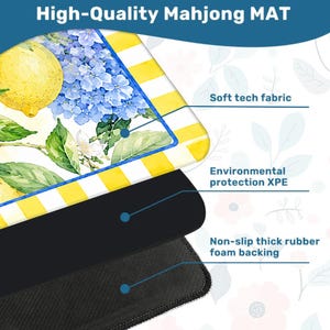 May include: A high-quality Mahjong mat with a lemon and hydrangea floral design. The mat features a yellow and white striped border. The mat is made of soft tech fabric, environmental protection XPE, and non-slip thick rubber foam backing.