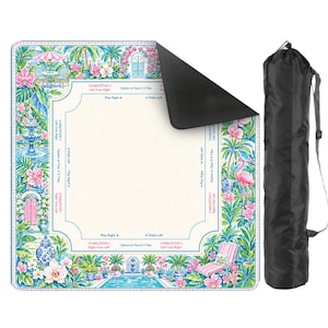 May include: A square Mahjong mat with a cream center and a colorful border featuring tropical plants, pink flamingos, fountains, and patio furniture. The mat includes printed game instructions and comes with a black cylindrical carrying bag.