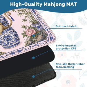 May include: A high-quality Mahjong mat with a floral and monkey design. The mat features a soft tech fabric, environmental protection XPE, and a non-slip thick rubber foam backing. The top layer has a pink background with blue and white floral patterns.
