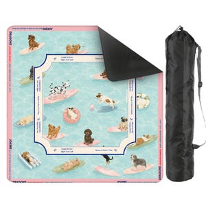 May include: A pink and blue play mat featuring cartoon dogs surfing on surfboards in a pool. The mat has a white border with text and a black carrying bag. The mat is designed for a game.