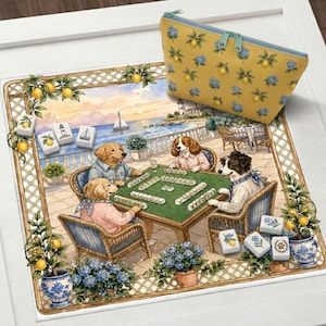 May include: A decorative mat and zippered pouch featuring a whimsical scene of dogs playing mahjong on a patio overlooking the ocean. The mat has a border with lemons and the pouch is yellow with lemon and blue flower patterns.