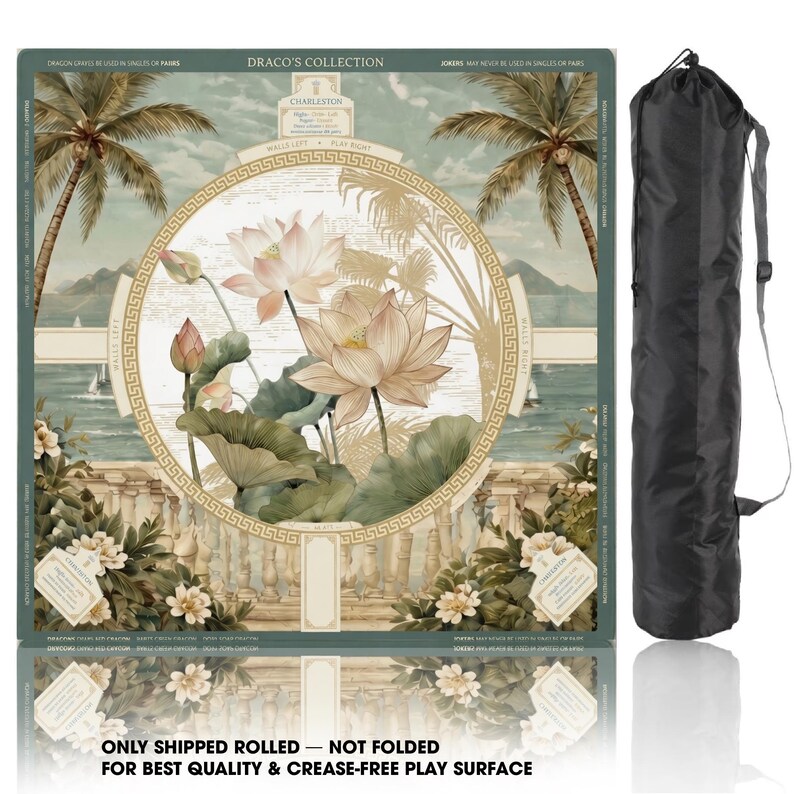May include: A square game mat from Draco's Collection featuring a central circular design with lotus flowers, palm trees, and a coastal landscape. The mat includes a Greek key border and comes with a black cylindrical carrying case with a shoulder strap.