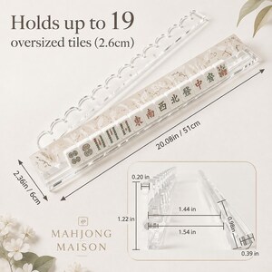 May include: A clear acrylic mahjong tile rack with a scalloped top edge, designed to hold up to 19 oversized 2.6cm tiles. The rack measures 20.08 inches long and 2.36 inches wide, with detailed side-view dimensions of 1.22 inches height and 1.54 inches depth.