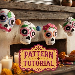 May include: A Day of the Dead themed garland featuring felt skull decorations with colorful floral and spiderweb designs. The skulls have pink, blue, and green accents. The garland is strung above a fireplace with candles and flowers.