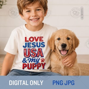 May include: A cream-colored short-sleeve t-shirt featuring the red and blue text LOVE JESUS USA & my PUPPY with a small red paw print graphic. The shirt is worn by a child who is embracing a golden-colored puppy with a happy expression.