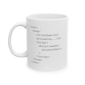 May include: White ceramic coffee mug with black text that reads "Coffee" and a code snippet. The code includes HTML tags and a "drinkCoffee()" function. The mug has a curved handle.