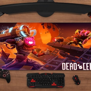 May include: A rectangular Dead Cells mousepad featuring a vibrant action scene with characters and the game's logo. The artwork showcases a character with a large weapon and another in combat, set against an orange and purple background. A black keyboard, mouse, and controller are also visible.
