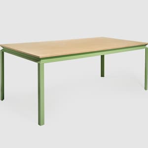 May include: A rectangular table with a light wood top and a green metal frame. The table has a simple, modern design. The table is approximately 60 inches long, 30 inches wide, and 30 inches high.