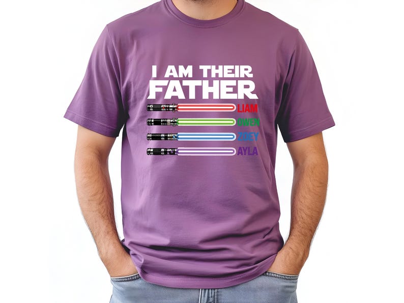 May include: Purple t-shirt with the text "I AM THEIR FATHER" and four lightsaber designs in red, green, blue, and purple. Each lightsaber has a name below it: Liam, Owen, Joey, and Ayla.