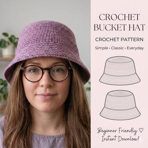May include: A person wearing a lilac crochet bucket hat. The image includes text that reads "CROCHET BUCKET HAT" and "CROCHET PATTERN". The pattern is described as "Simple, Classic, Everyday" and "Beginner Friendly".