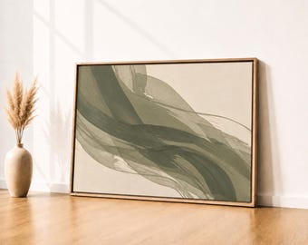 May include: A rectangular wall art piece in a wooden frame featuring abstract sage green brushstrokes on a cream background, displayed alongside a ceramic vase containing dried pampas grass stalks on a wooden floor surface.