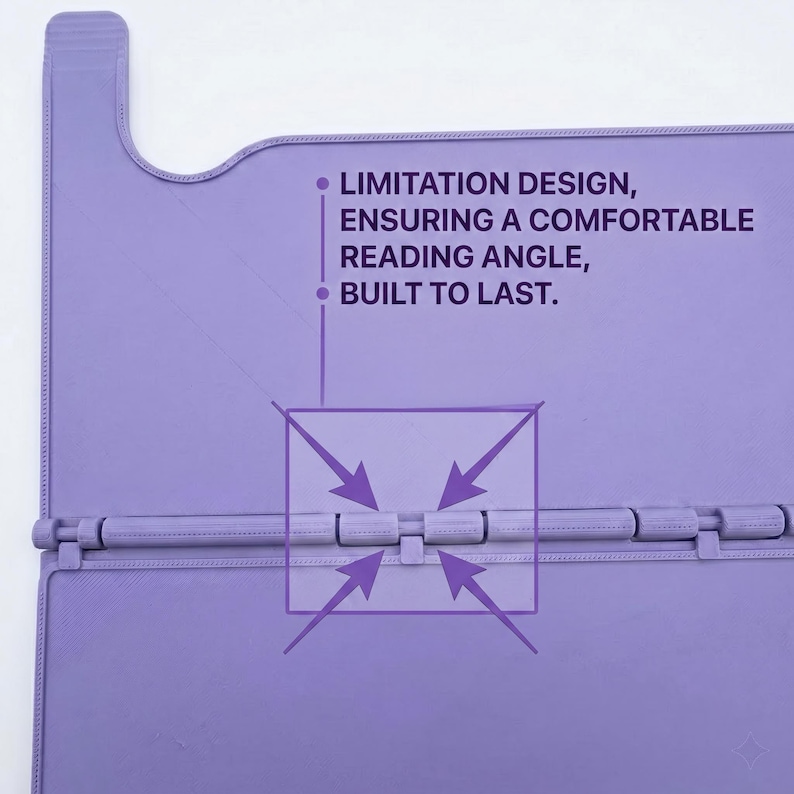 May include: A light purple book stand featuring a hinged design with a central joint mechanism. The surface includes the printed text: LIMITATION DESIGN, ENSURING A COMFORTABLE READING ANGLE, BUILT TO LAST, with arrows pointing to the hinge detail.