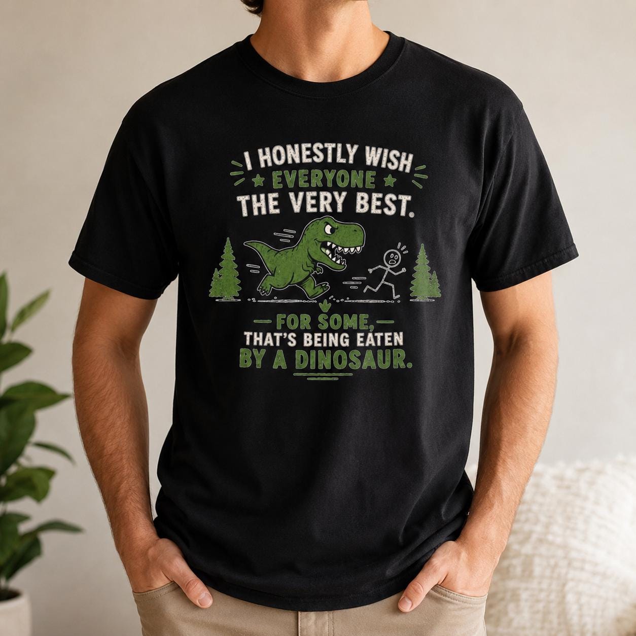 Schwarzes T-Shirt mit Dinosaurier-Print und englischem Sarkasmus-Spruch, auf Stuhllehne gelegt