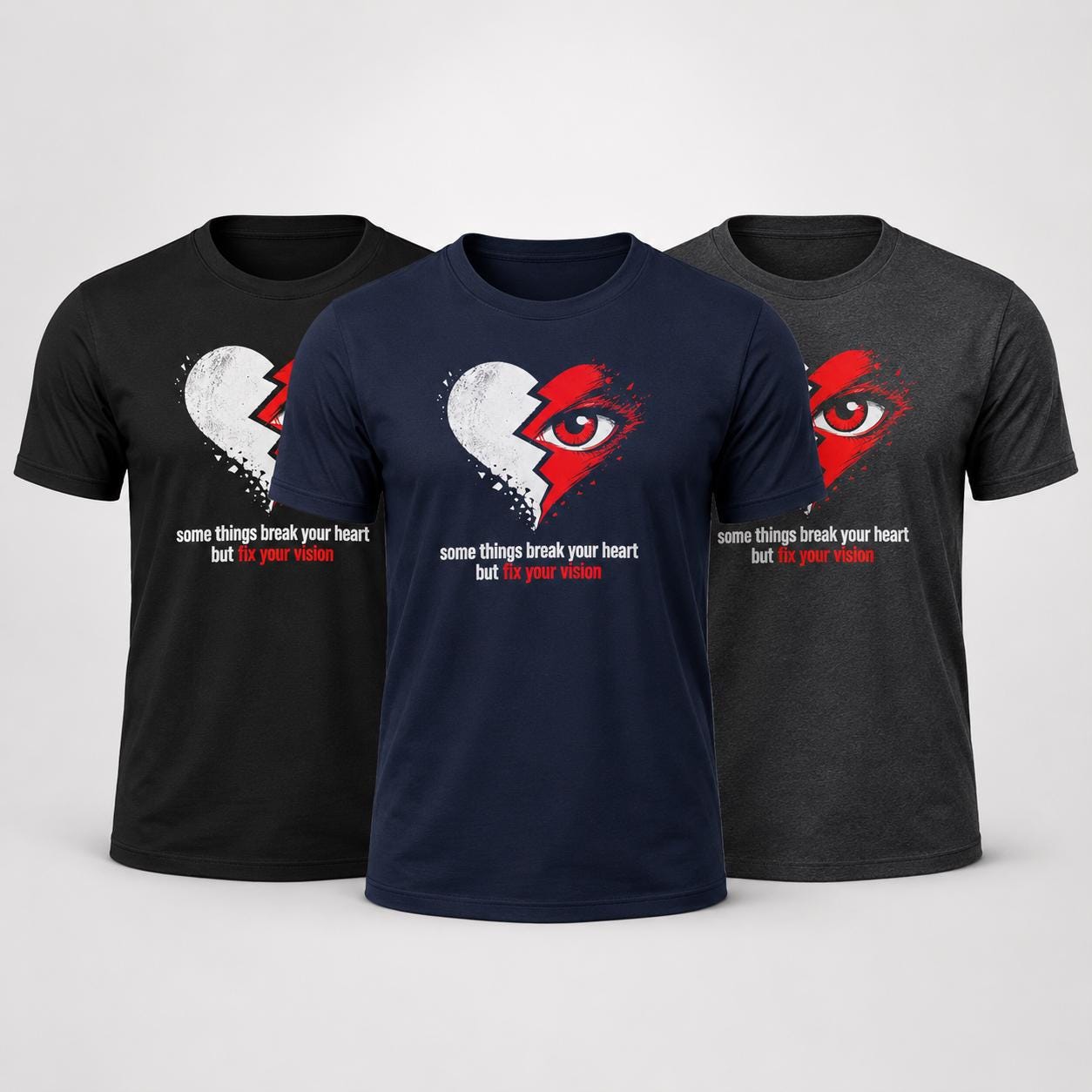 Drei schwarze bzw. dunkelblaue Unisex T-Shirts mit dem Herz und Auge Print und Spruch in verschiedenen Farbvariationen