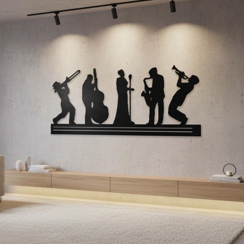 May include: Black metal wall art depicting a jazz band silhouette. The artwork features musicians playing a trombone, double bass, singing with a microphone, saxophone, and trumpet. The piece is mounted on a horizontal black bar, suitable for a music-themed room.
