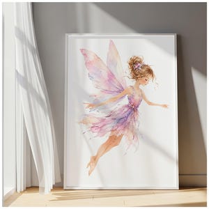 May include: A framed wall art print featuring a watercolor illustration of a fairy with light brown hair in a bun, wearing a purple and pink dress with matching translucent wings, depicted in a graceful flying pose against a white background.