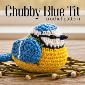 May include: A crocheted blue tit bird with a blue head and wings, a yellow body, and a black beak. The bird sits on a bed of twigs with white buds. The text "Chubby Blue Tit crochet pattern" is displayed above the bird.